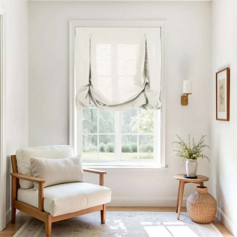 Cozy living room with a wooden armchair, small table with a plant, and framed picture.