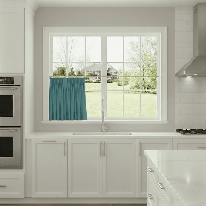 Modern kitchen with a window view of a house and trees