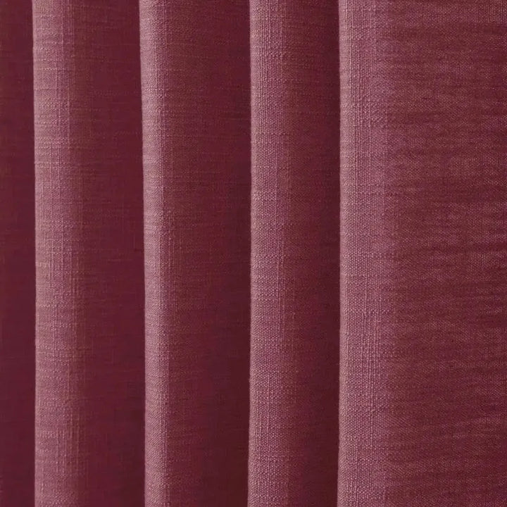 Close-up of textured purple fabric with vertical stripes