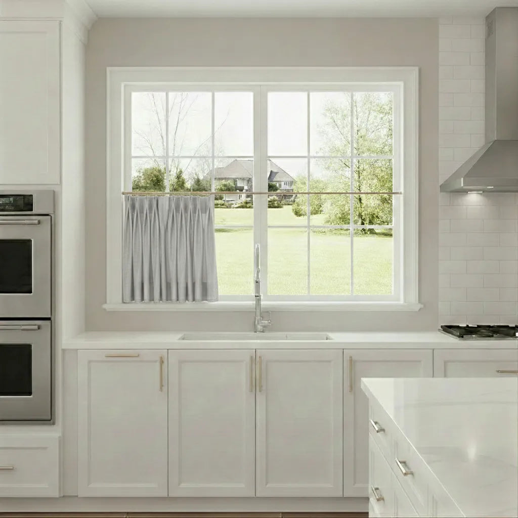 Modern kitchen with a window view of a house and trees