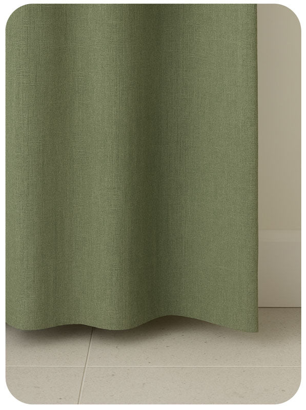 Green textured fabric on a beige background