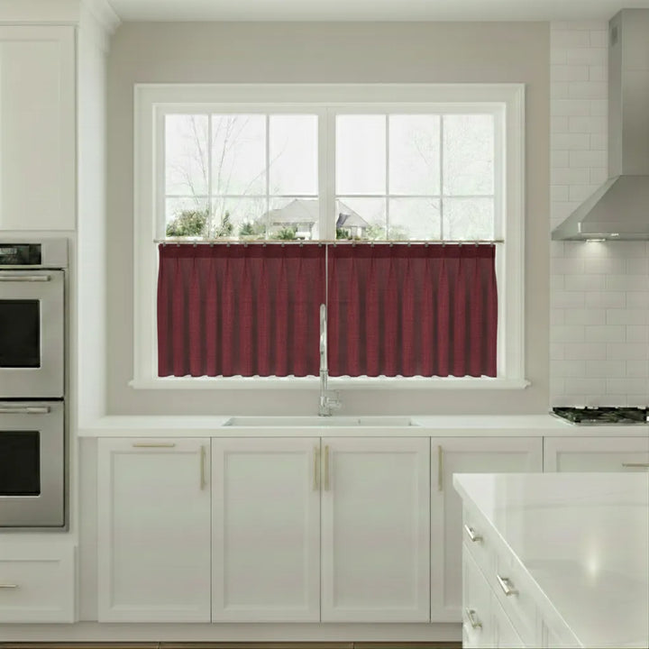Kitchen with red window valance over a sink